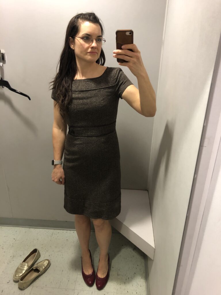 trying on a cute tweed dress