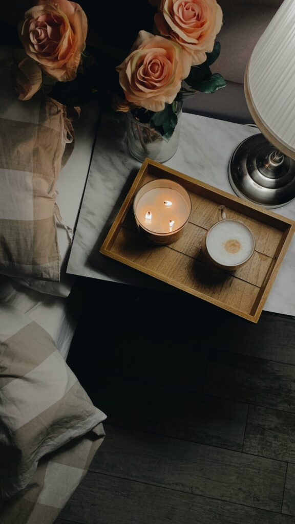 candlelight & coffee on bedside table