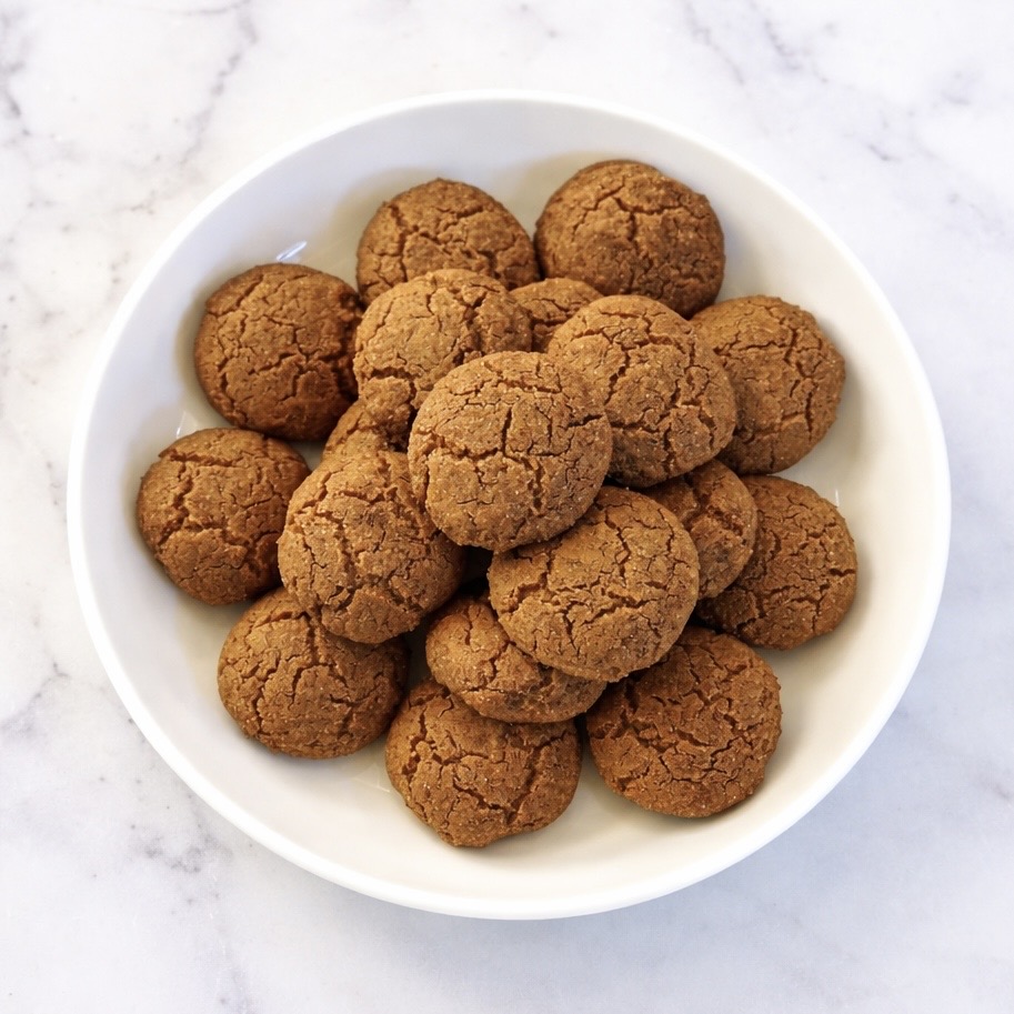 Soft ginger cookies on a wooden board