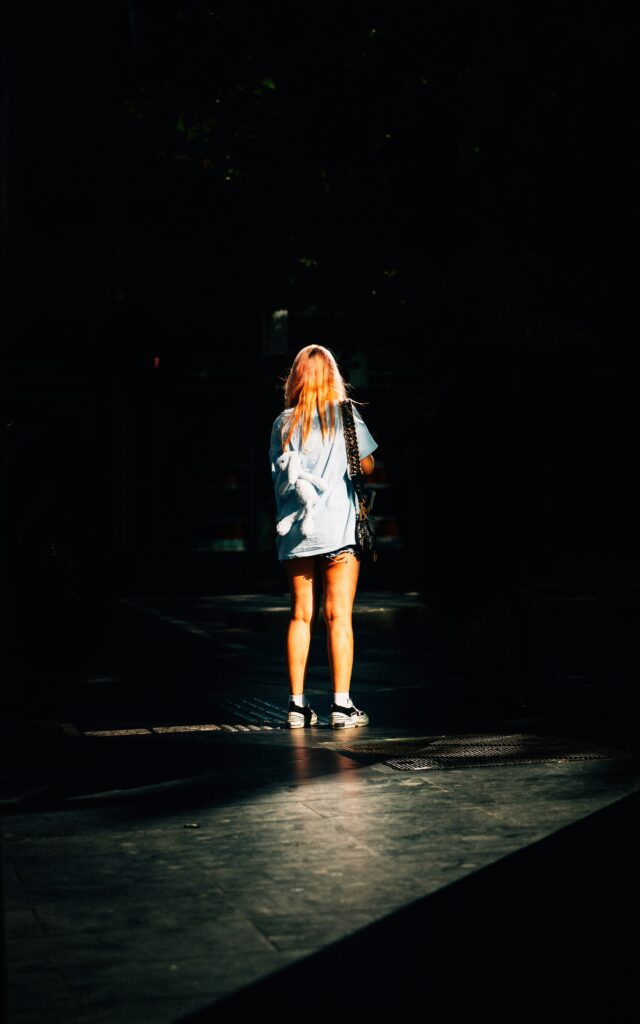 woman walking in the light